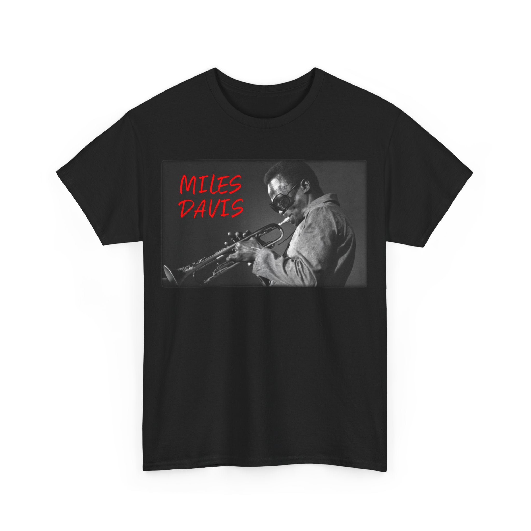 A black & white photographic image of Miles Davis playing trumpet in cool shades, with red text saying ‘Miles Davis’