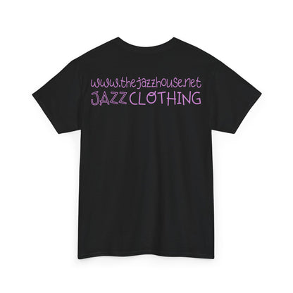 A t-shirt featuring ‘The Jazz House’ logo image of a trumpeter leaning against the wall of The Jazz House club playing, whilst purple smoke rises from his instrument. The scene is set in a dimly lit alley. The rear of the shirt has the website URL with the words ‘Jazz Clothing.’