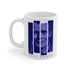 A white coffee mug with blue blocks making up the image of the jazz trumpeter Chet Baker