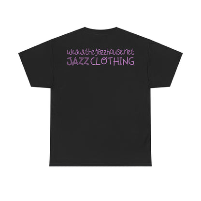 A t-shirt featuring ‘The Jazz House’ logo image of a trumpeter leaning against the wall of The Jazz House club playing, whilst purple smoke rises from his instrument. The scene is set in a dimly lit alley. The rear of the shirt has the website URL with the words ‘Jazz Clothing.’