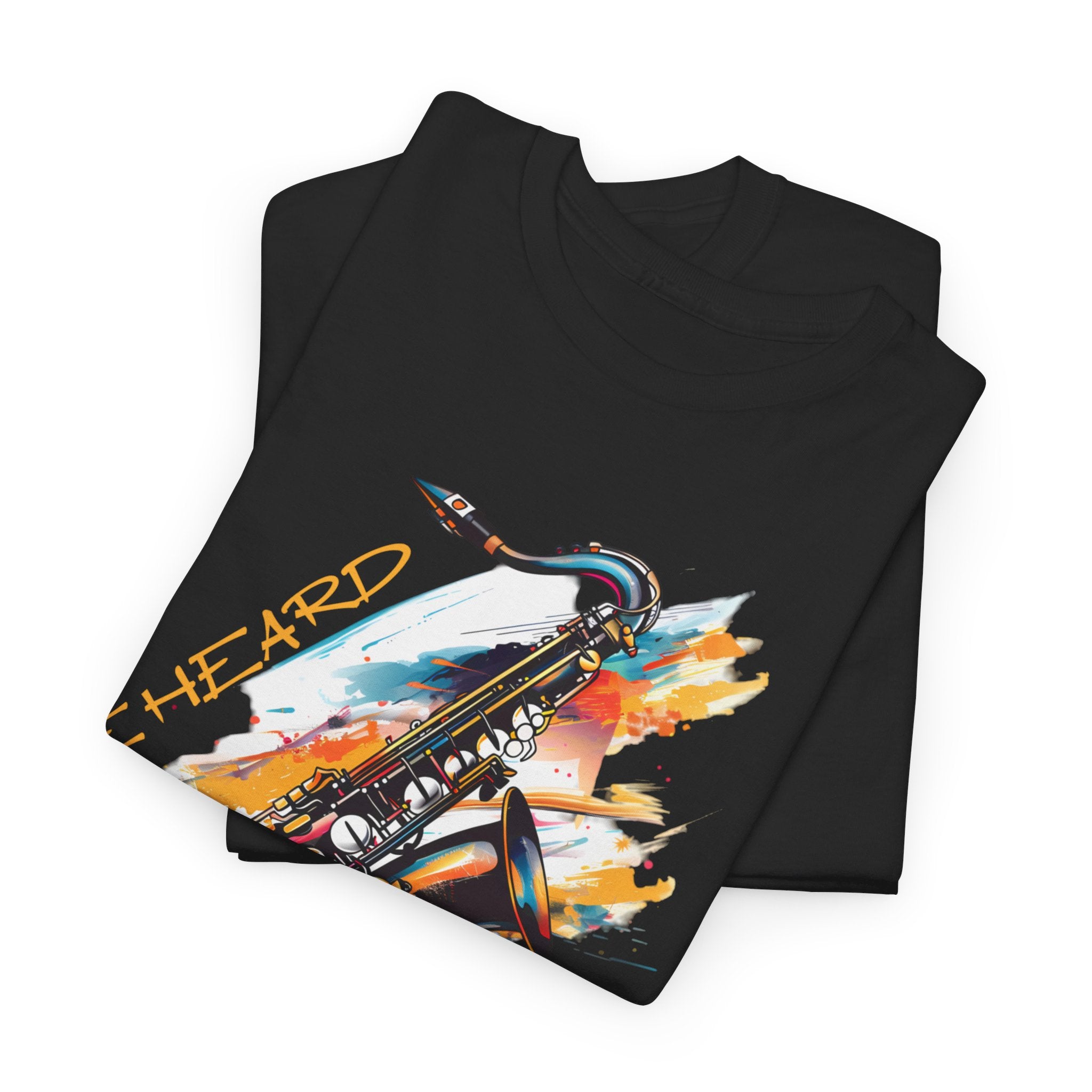 A black t shirt with a saxophone image. The words ‘Jazz, Be heard’ surround the image.