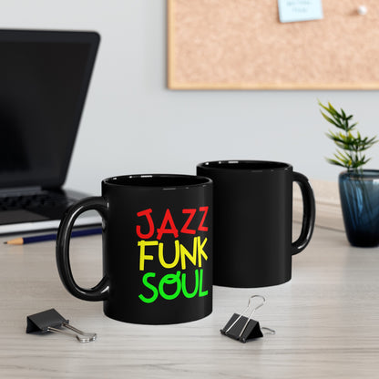 A black coffee mug with unusual funky font saying JAZZ, FUNK, SOUL, in red, yellow &amp; green.