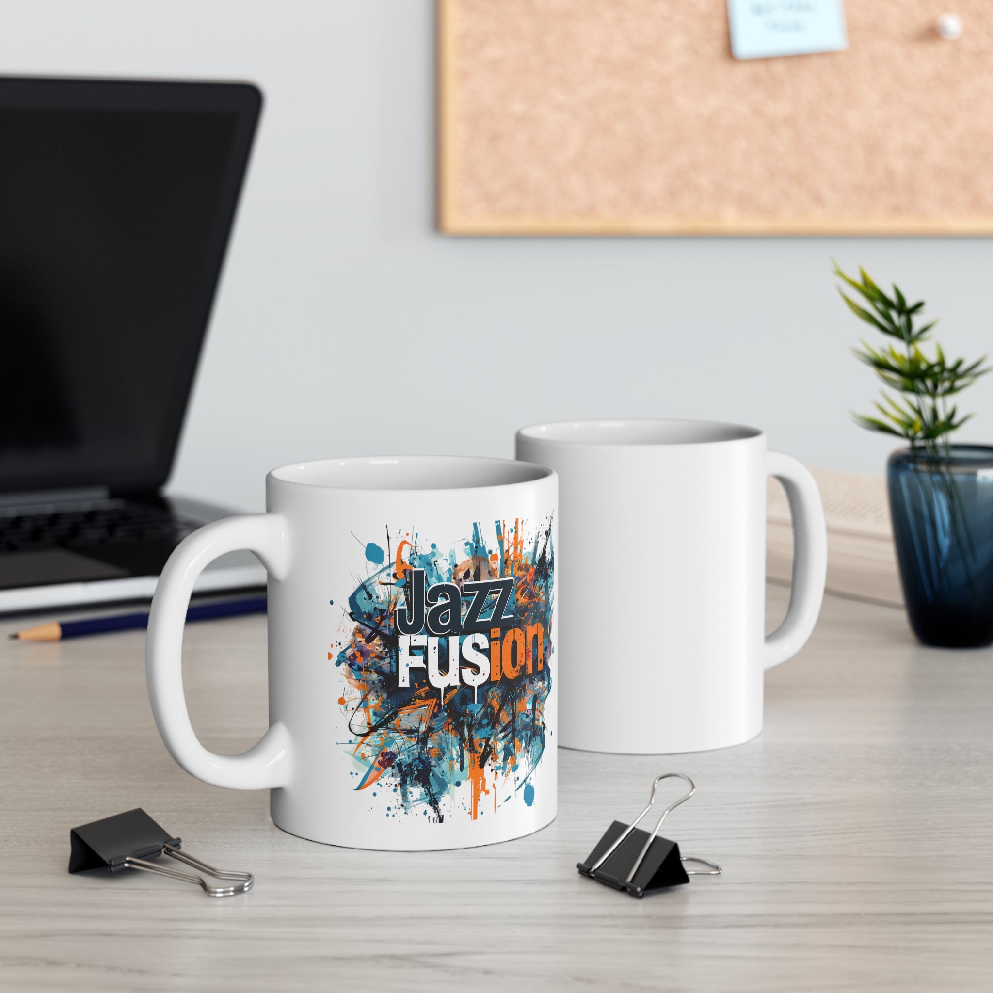 A white coffee mug with an abstract design like blotched paint image the text states ‘Jazz Fusion’